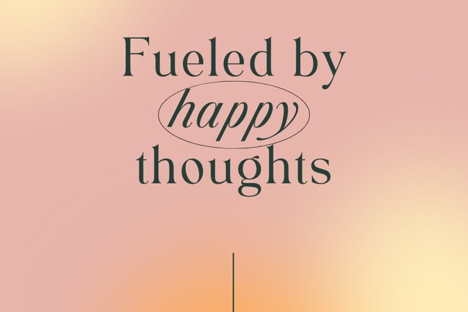 Affirmation wallpaper reading "Fueled by happy thoughts"